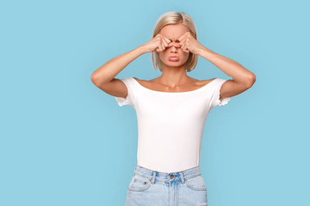 istock Young adult model covering with hands crying face 1272733788