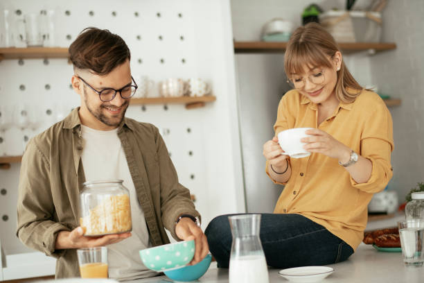 istock Young couple making breakfast at home. 1272737550