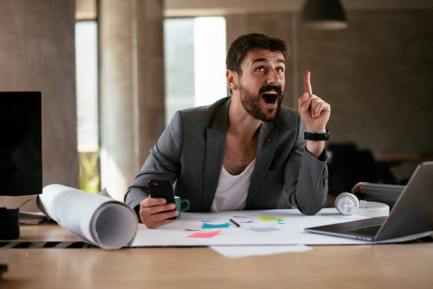 istock Handsome businessman in suit working in the office. 1272741539