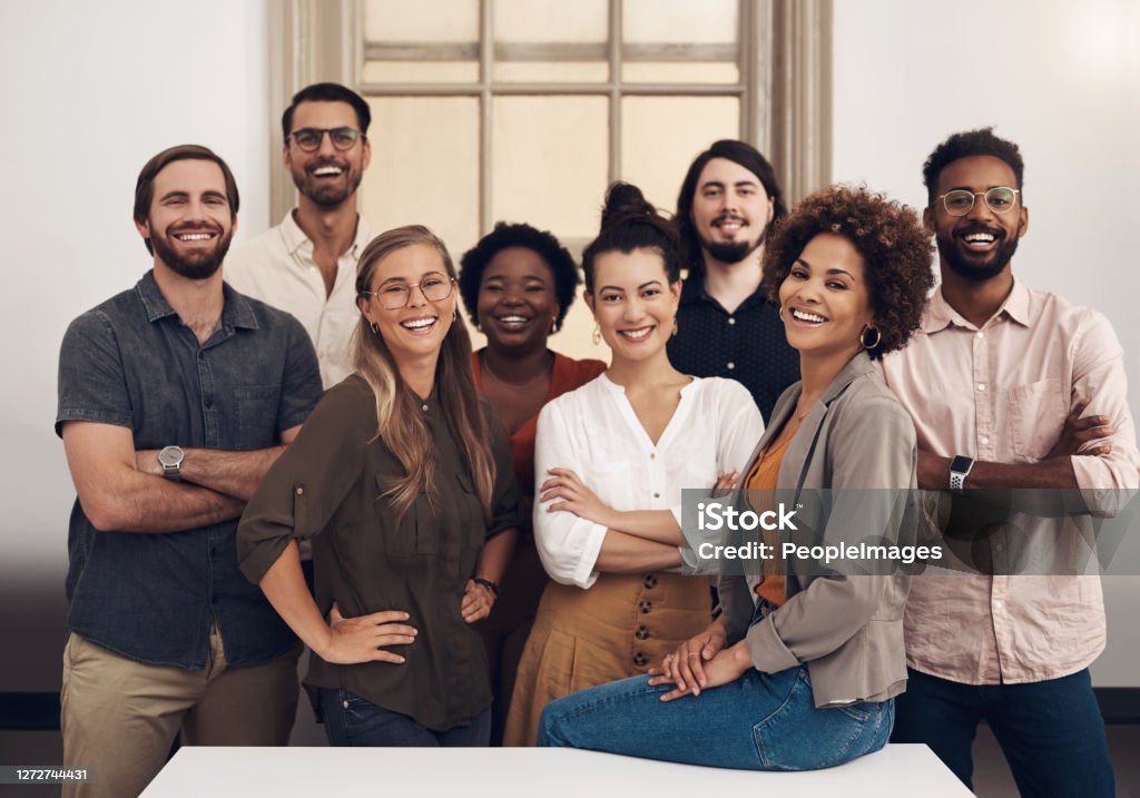 They're ready to push towards success with tenacity and confidence Portrait of a group of businesspeople standing together in an office Multiracial Group Stock Photo