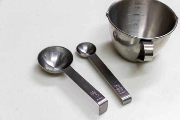 istock Metal measuring cup and measuring spoon 1272744600
