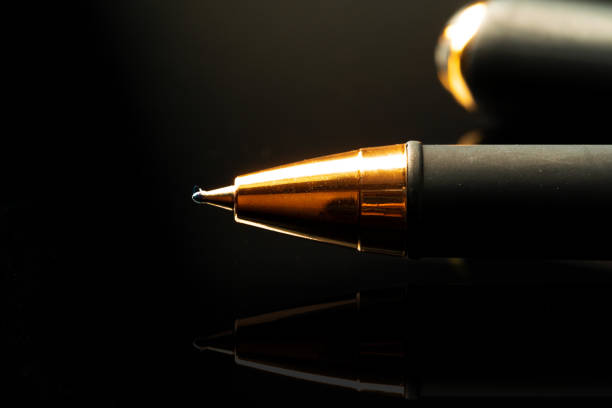 istock Close up of a pen on black background 1272744809