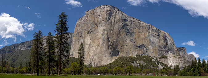 El Capitan Panoramic in Yosemite National Park California. Blue sky with light clouds in the background. This Panorama is made from multiple images merged together.