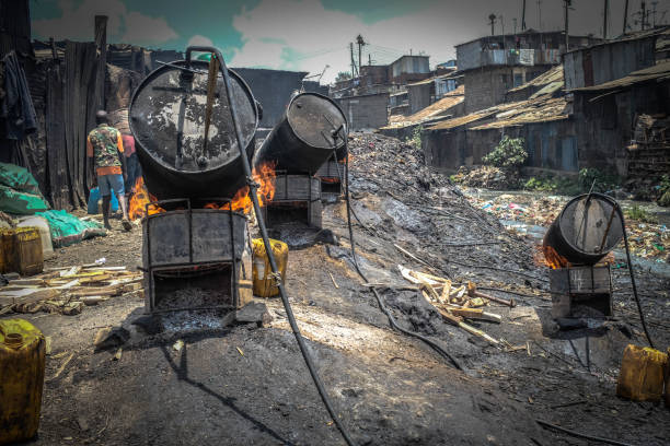 Survival through brewing of Chang'aa in the Slums. stock photo