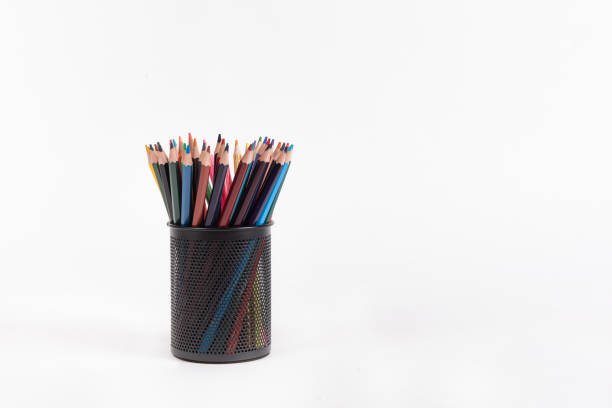 istock Colour pencils in metal pencil box. Isolated on white. 1272747784