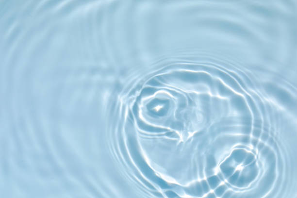 istock transparent blue colored clear calm water surface texture 1272747913