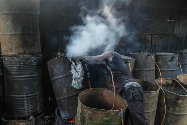 Survival through brewing of Chang'aa in the Slums. stock photo