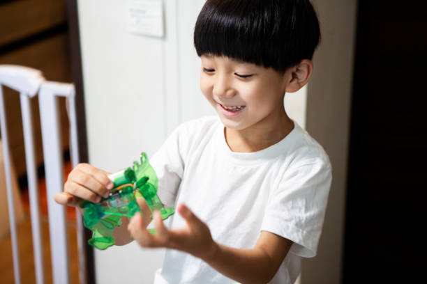 istock A boy who touches a robot and plays happily 1272750259