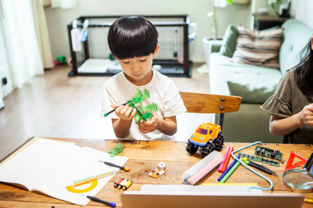 istock Brothers are doing electronic work together 1272750380