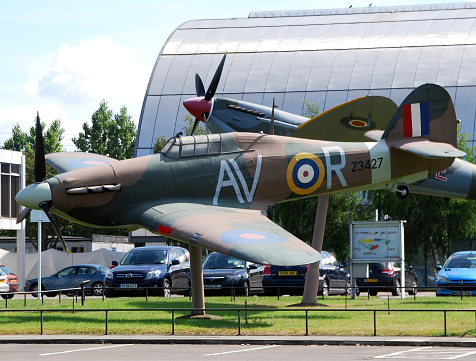 Royal Air Force (RAF) Museum / Hendon, London, UK - June 29, 2014: A Spitfire and a Hurricane on display at the main entrance of the museum.