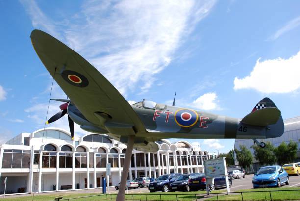 A Spitfire fighter on display in London Royal Air Force (RAF) Museum / Hendon, London, UK - June 29, 2014: A Spitfire on display at the main entrance of the museum. spitfire stock pictures, royalty-free photos & images