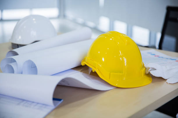 istock Safety helmet and glove on table at project site 1272751023