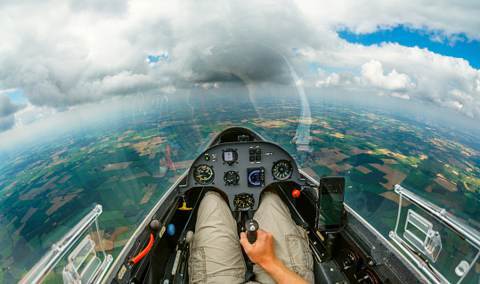 View from an airplane cockpit with clouds in flight