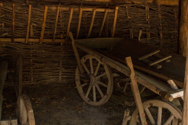 istock old wooden cart in a barn with straw 1272751123