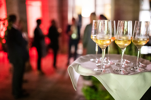 Germany: Champagne is on a tray during a business reception in the evening.