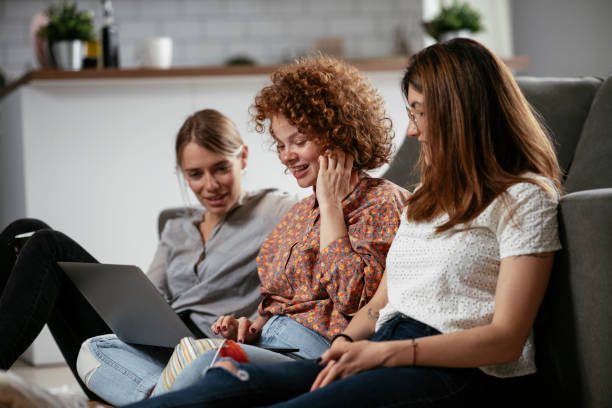 istock Girlfriends talking and laughing in office. 1272752163