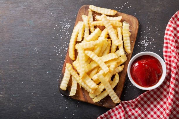 istock French fries with ketchup on dark table 1272753984