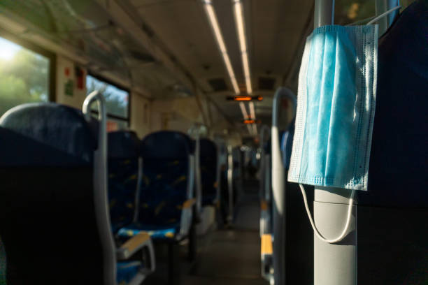 istock Empty inside train bus subway public transport with window view and blue seats people tourist new normal social distancing safe travel with hygiene face mask protect from covid corona virus 1272754148
