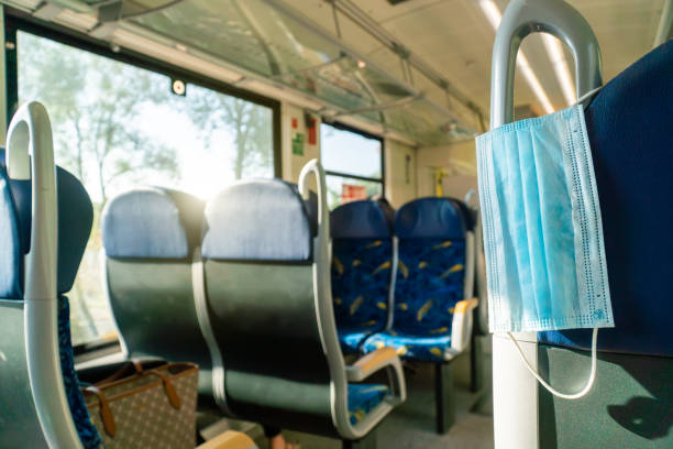 istock Empty inside train bus subway public transport with window view and blue seats people tourist new normal social distancing safe travel with hygiene face mask protect from covid corona virus 1272754313