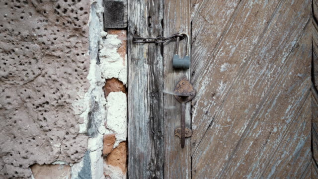 Door of an old house with locks