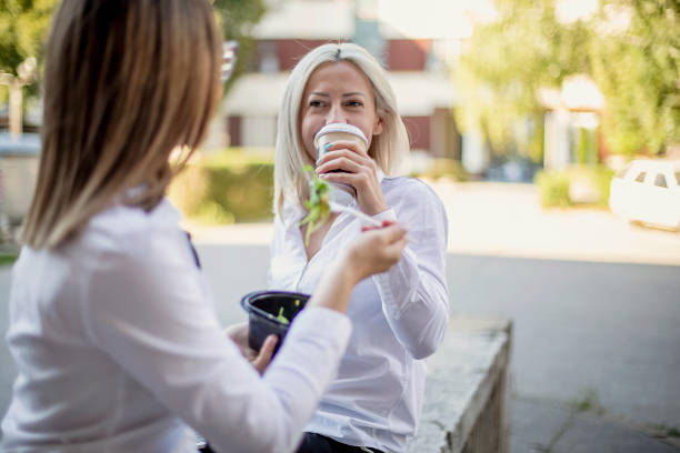 istock Two businesswomen colleagues having a lunch break 1272758552