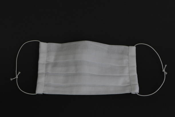 istock Handmade medical face mask on black background. 1272760617
