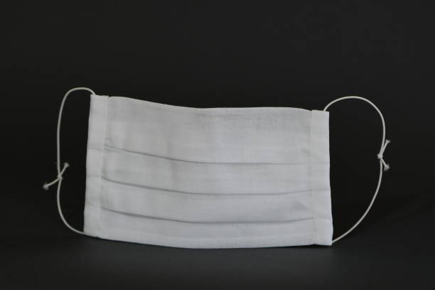 istock Handmade medical face mask on black background. 1272760618