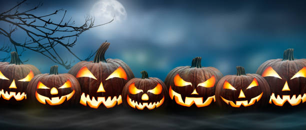 istock Seven spooky halloween pumpkin, Jack O Lantern, with an evil face and eyes. 1272760822