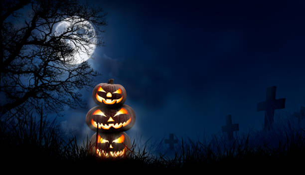 istock A stack of 3 spooky halloween pumpkin, Jack O Lantern, with an evil face and eyes. 1272760935