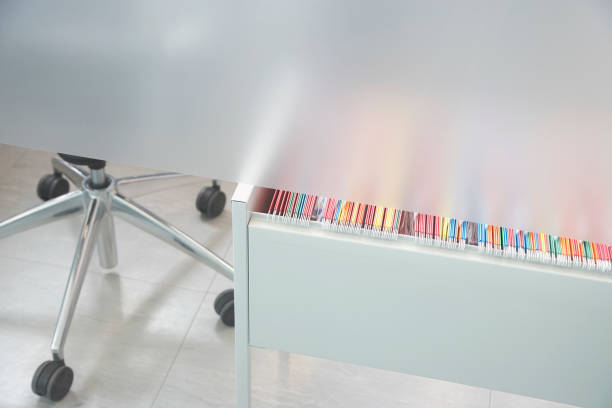 istock File folders in drawer partly visible under metal cubicle wall 1272761137