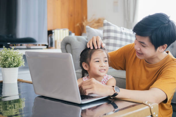 istock Young man and school-girl working form home 1272763659