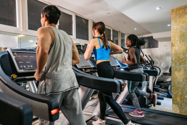 istock People running on treadmill in gym 1272764117