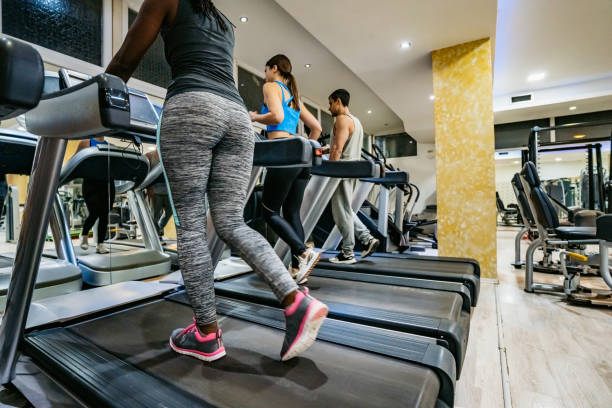istock People running on treadmill in gym 1272764185