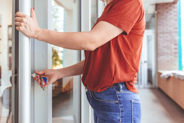 istock Woman opening store, unlocking the door 1272767795