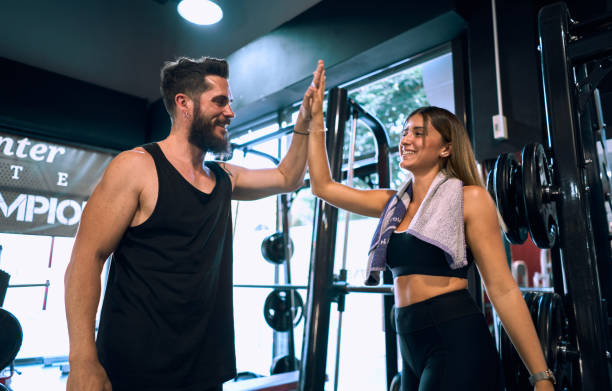 istock Two friends high five at the gym 1272773171