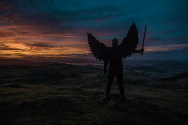 istock Black Winged Warrior Angel at dawn 1272775155
