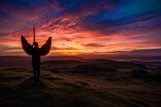istock Black Winged Warrior Angel at dawn 1272775383