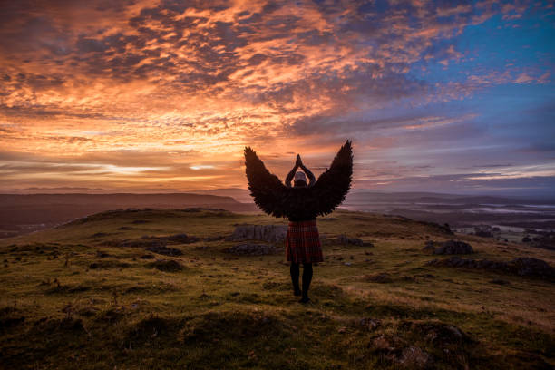 istock Black Winged Warrior Angel at dawn 1272776103