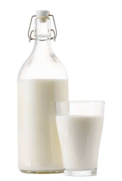 istock Closed glass milk bottle isolated on white background 1272776107