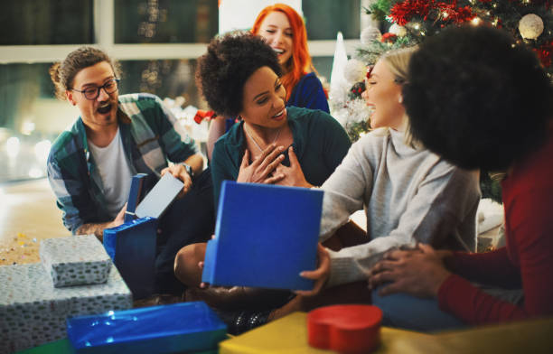 istock Opening Christmas presents with best friends. 1272778071
