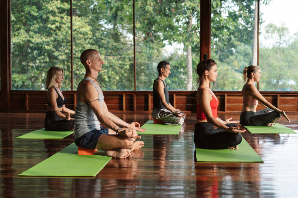 istock People meditating during yoga lesson 1272779662