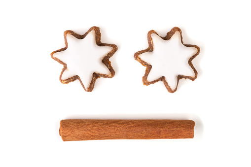 Cinnamon stars and cinnamon stick, Christmas face concept