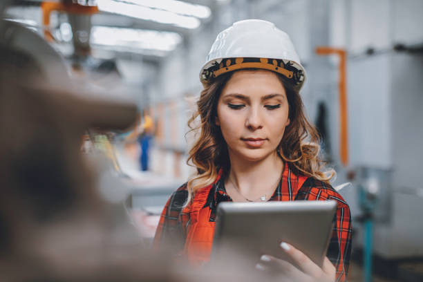 istock Young female maintenance engineer working with digital tablet 1272780440