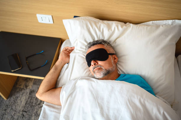istock Mature man sleeping in bed 1272780466