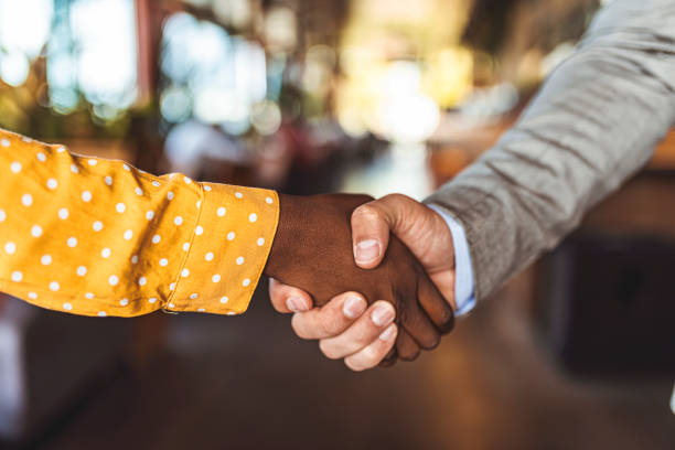 istock Business handshake close-up, partners shaking hands for agreement approval 1272781407