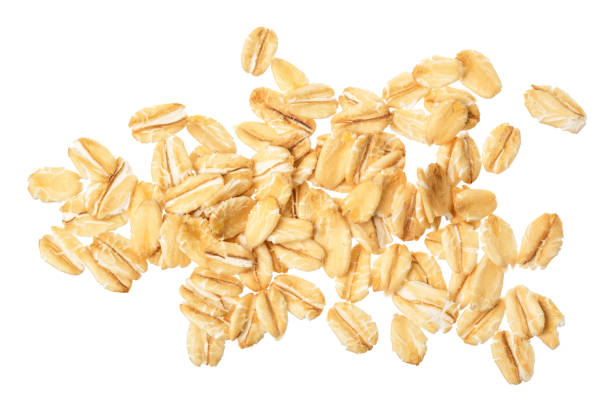 istock oat flakes isolated on white background. Top view 1272785889