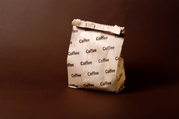 paper bag with coffe, on a brown background , horizontal, copy spase