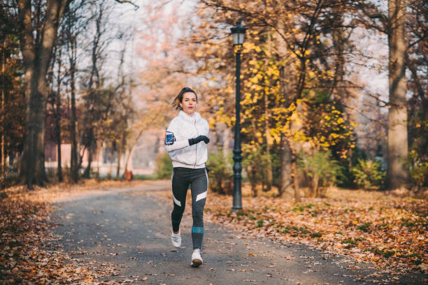 istock Jogging in autumn park 1272787545