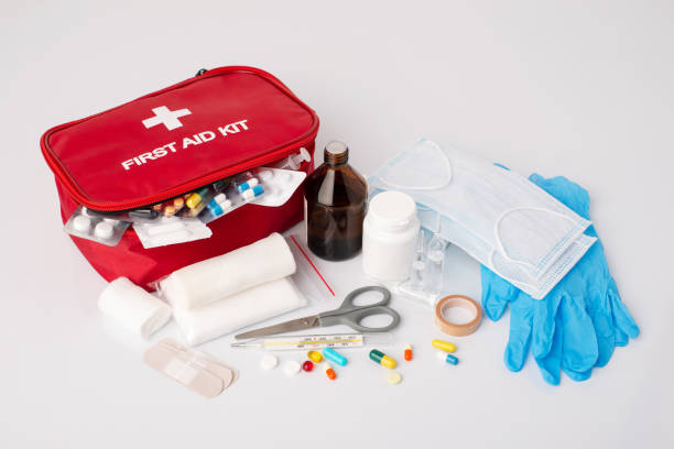 Full set of emergency medicine, medication for giving first aid to a sick or injured person on white background First aid kit on white table. first aid stock pictures, royalty-free photos & images