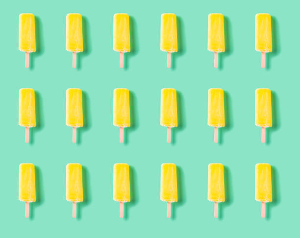 istock seamless yellow popsicle on a light green background 1272789661